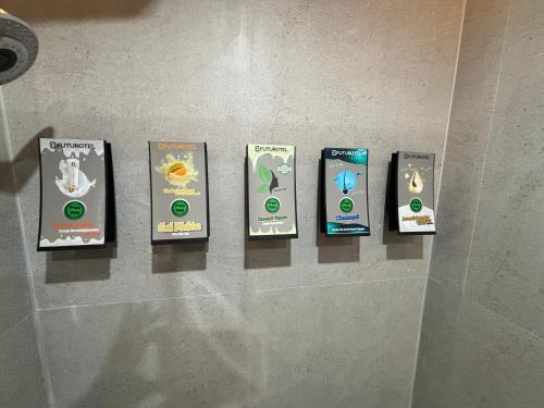 a group of books on a wall in a bathroom at Futurotel Granada Dreams in Granada