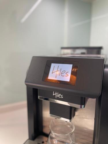 a likles coffee machine with a sign on it at Kenting Onehome in Checheng