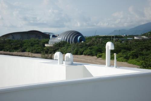 a view of a observatory from the roof of a building at Kenting Onehome in Checheng