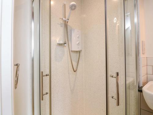 a shower with a shower head in a bathroom at Surf View in Kingsbridge