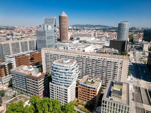 an aerial view of a city with tall buildings at Nemea Appart Hotel So Cloud Lyon Gare Part-Dieu in Lyon
