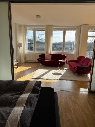 a living room with a couch and a chair and a couch at K9 Wohnungen in Münster