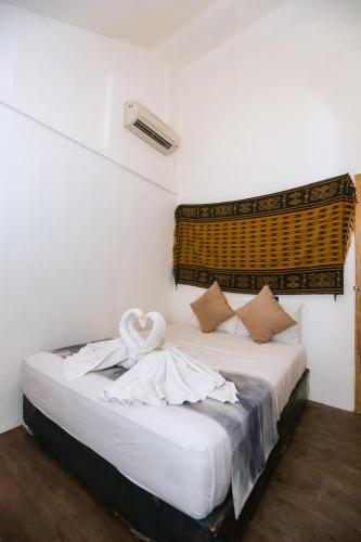 Postel nebo postele na pokoji v ubytování Gili Hills