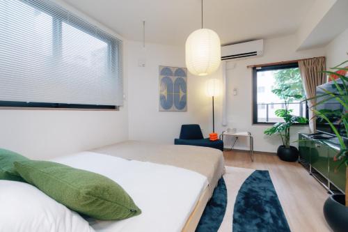 a bedroom with a bed and a large window at 寅ホテル新江古田TORA HOTELShinEkoda in Tokyo