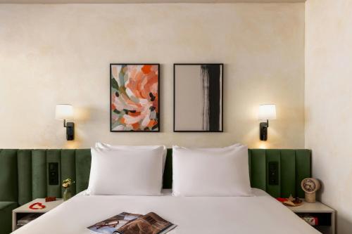 a bed with two white pillows in a room at Salitre Hotel, Sonder by Marriott Bonvoy in Málaga