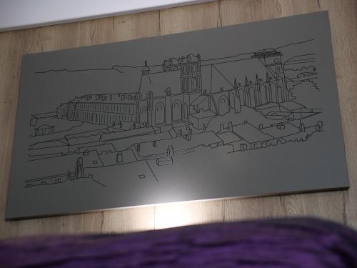 a drawing of the palace of westminster on a wall at Hotel de la Gare in Saint-Mihiel