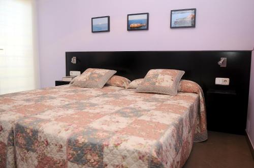 A bed or beds in a room at La Estancia del Rincon