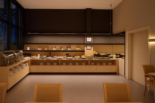 Кухня или мини-кухня в Petit Palace Trencadís
