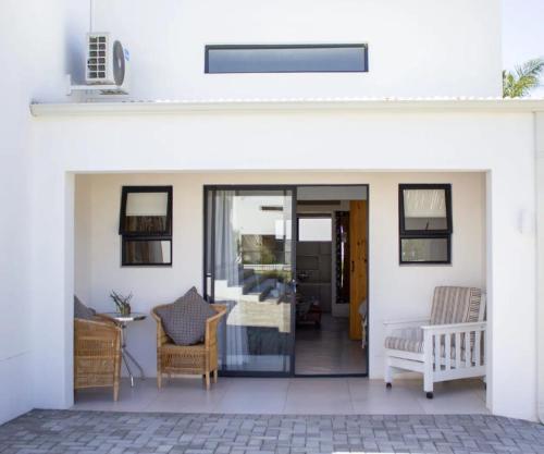 a patio with a door leading into a house at Karoo Retreat- Self Catering Villas and Guest House in Oudtshoorn