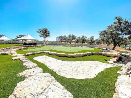 a golf course with a retaining wall and a green at Resort at Fredericksburg Unit 28 in Rocky Hill
