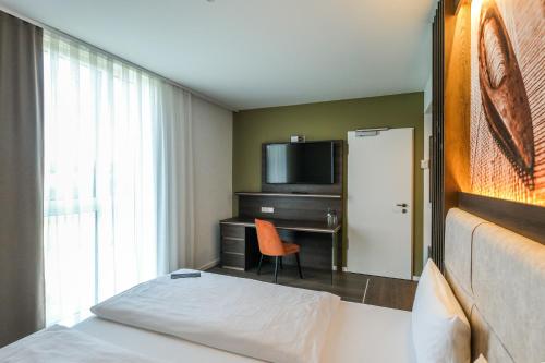 Tools Hotel Laichingenにあるベッド
