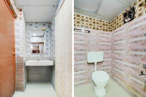 a bathroom with a toilet and a sink at Super Hotel O Vadapalani Metro Station Chennai Formerly Vishnu's Galaxy Rooms in Chennai