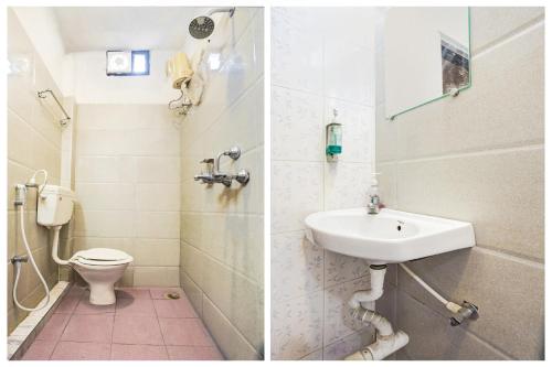 a bathroom with a sink and a toilet at Super Hotel O Hingna Road Near Rachana Metro Station in Nagpur