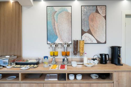 a counter with some food on it in a kitchen at Erdeti Boutique Hotel in Sarandë
