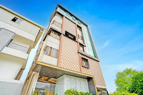 a tall brick building with a large window at Super Townhouse Indiranagar in Bengaluru