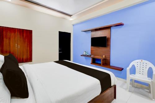 Postel nebo postele na pokoji v ubytování Super Hotel O GT Road Nellore