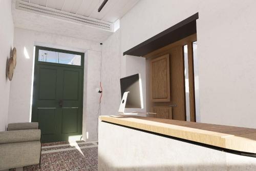 a living room with a green door and a couch at Kentrikon 1924 Boutique Hotel, Paphos Old Town in Paphos City
