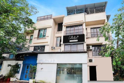 a building with a sign in front of it at Super Collection O Andheri Near Mumbai Airport Formerly We Stay in Mumbai