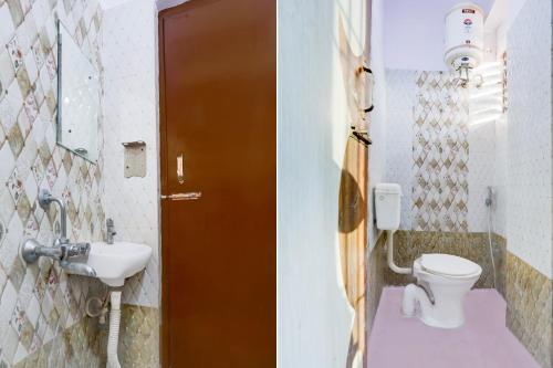 a bathroom with a toilet and a sink at Super Hotel O Rajeev Nagar Formerly Happy Journey in Patna