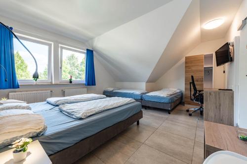 Una cama o camas en una habitación de MK Hostel Oyten - free Wifi & Parking - 24h Check-In