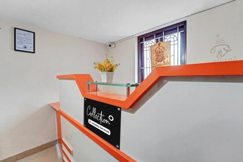 an orange and black counter in a room with a window at Super Collection O Coimbatore Near Adithya Institute Formerly Hotel Everest Grand in Coimbatore