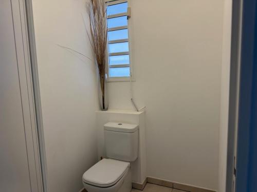 Koupelna v ubytování TropiClub Charm appartement avec piscine