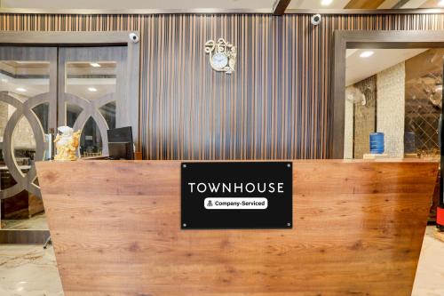 a view of a showroom with a town house sign on a counter at Super Townhouse Hyderabad Gate IIT BHU Formerly RK Heights in Varanasi