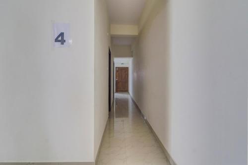 a hallway with a number on the wall at Super Collection O Manikonda in Hyderabad
