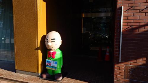 a statue of a person standing in front of a door at HOTEL TETORA ASAHIKAWA EKIMAE - Vacation STAY 91497v in Asahikawa