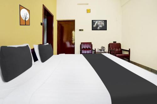 Ένα ή περισσότερα κρεβάτια σε δωμάτιο στο Super Hotel O Thrissur Near Thrissur Medical College