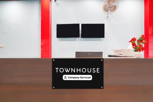 a sign that reads townhouse and company startled at Super Townhouse Jeevan Bima Nagar Indranagar in Bengaluru