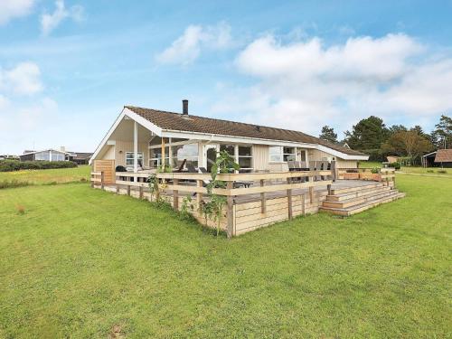 a house with a large yard in front of it at 9 person holiday home in Millinge-By Traum in Millinge
