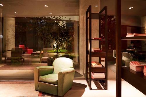 a store with a chair in a store window at Zambala Luxury Apartments in Milan