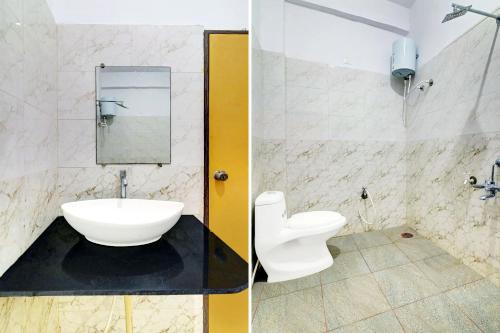 a bathroom with a sink and a toilet at Super Collection O Hassan Industrial Area formerly Sagayi Resort in Hassan