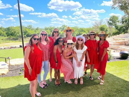 a group of women in red dresses posing for a picture at Resort at Fredericksburg Unit 20 in Rocky Hill
