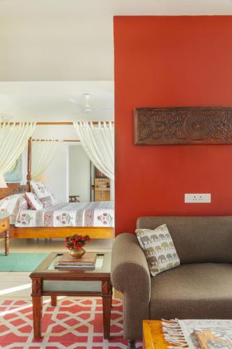 a living room with a couch and a bed at Ramathra Fort in Sapotra
