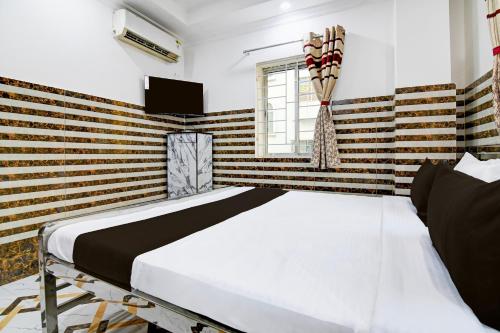 Postel nebo postele na pokoji v ubytování Super Hotel O Hiland Park Formerly Ayush Villa