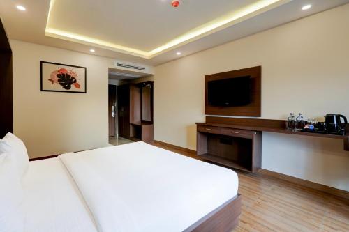 Super Townhouse Oak Mahadevapura Opposite Phoenix Mall Formerly Grand Wilton Innにあるベッド