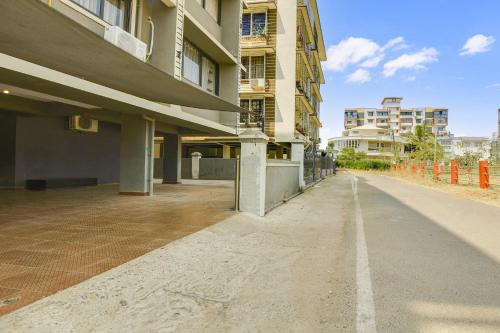 an empty street in front of a building at Super Hotel O Dabolim Near Goa International Airport in Goa