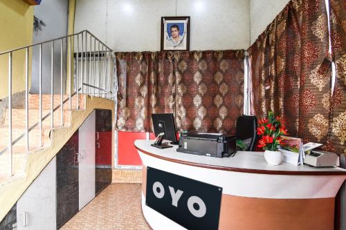 an office with a desk with a cash register at Super Hotel O Kabardanga More Kolkata Formerly Royal Crown Banquet in Taliganja