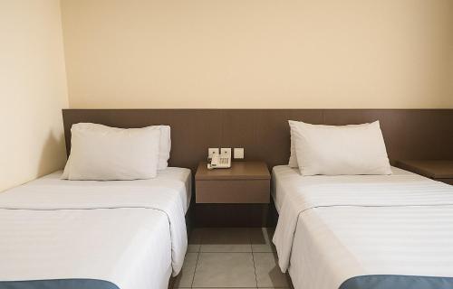 Cama o camas de una habitación en Ciptaningati Culture Hotel Batu