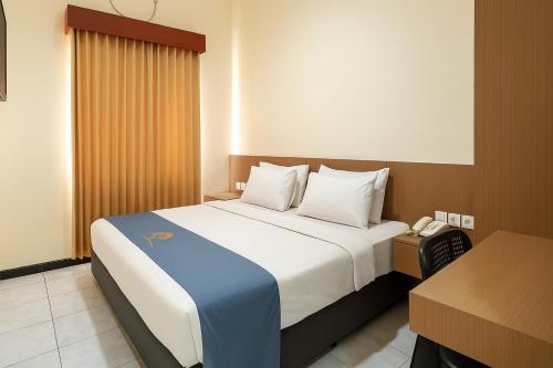 Cama o camas de una habitación en Ciptaningati Culture Hotel Batu