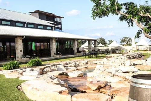 a building with rocks in front of a building at Resort at Fredericksburg Unit 24 in Rocky Hill