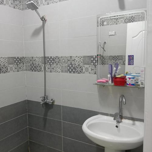 a bathroom with a sink and a mirror at Hurghada City apartments Red sea in Hurghada