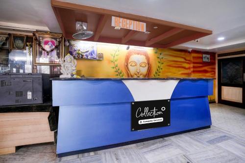 a counter in a store with a sign on it at Super Collection O Hubli City Center Formerly Chalukya Residency in Hubli