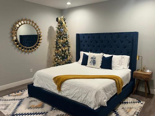 a bedroom with a christmas tree and a bed at The Pennington Inn in Tishomingo