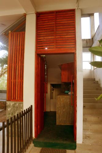 an open door to a kitchen in a house at Blue Sky in Mirissa