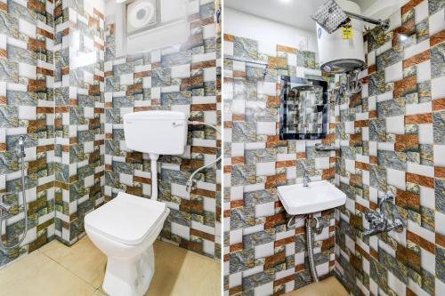 a bathroom with a toilet and a sink at Super Collection O Mourigram Near Andul Road in Sānkrāil
