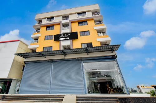 a yellow building with a sign on it at Super Collection O Hinjewadi Phase 1 Formerly Mars Venture in Hinjewadi