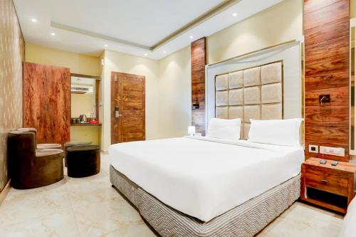 a bedroom with a large white bed in a room at Palette Patliputra Colony Formerly The Aurum in Patna